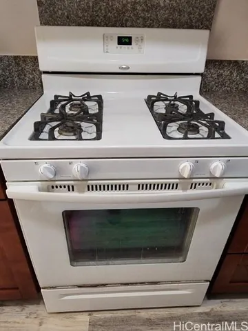 a close view of a stove top oven sitting inside of a kitchen