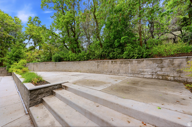 1389 Millbrook Way Bountiful, UT 84010 - Photo 64 of 74 Tiered concrete patio featuring block retaining walls