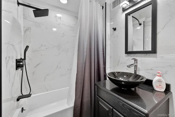 a bathroom with a sink a toilet and a bathtub