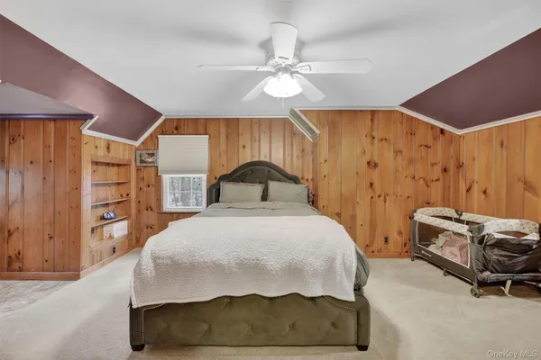 a bedroom with a bed and a cabinets