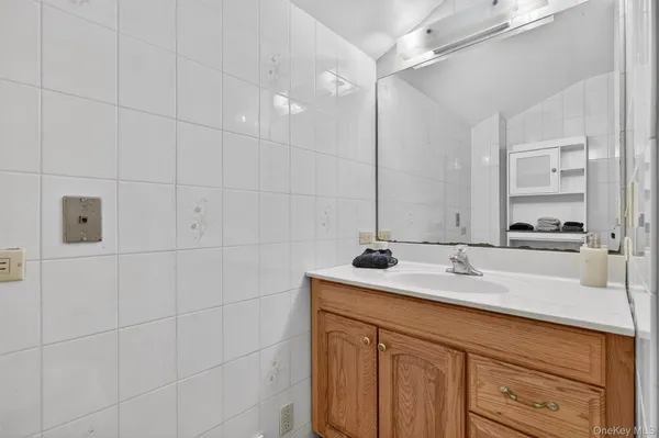 a bathroom with a sink and vanity
