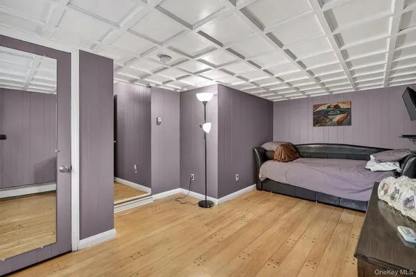a bedroom with furniture and a chandelier