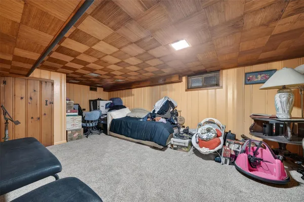 a bedroom with furniture and a window