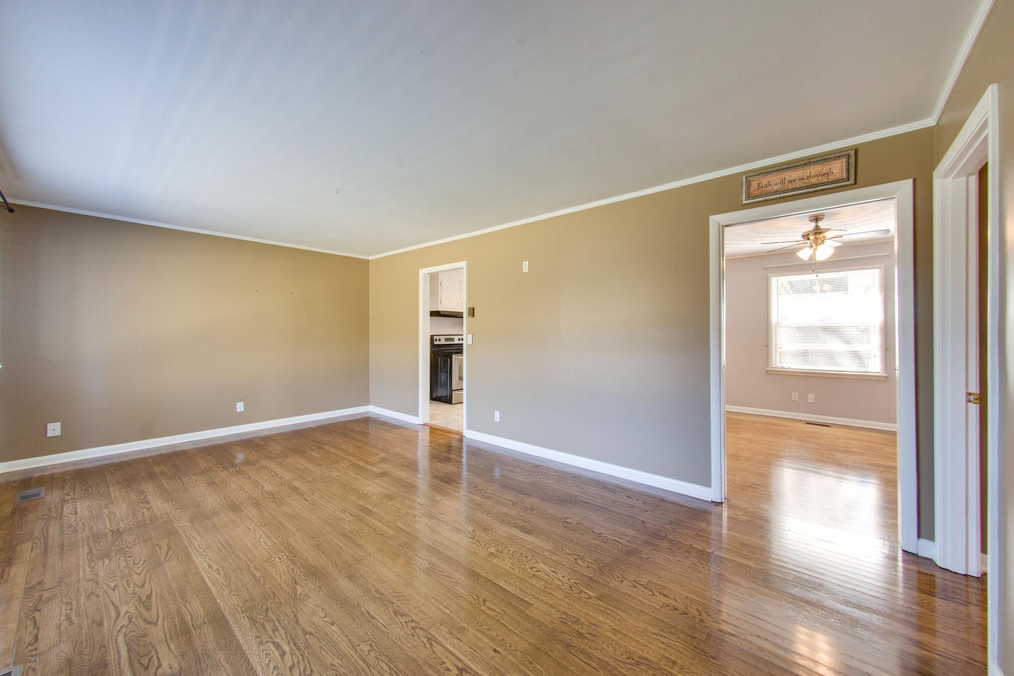 1108 Sam Davis Road Smyrna, TN 37167 - Photo 5 of 27 Living room view to dining area and kitchen. Beautiful hardwood floors.