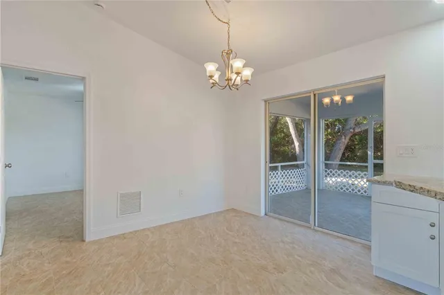 a view of a kitchen with granite countertop cabinets