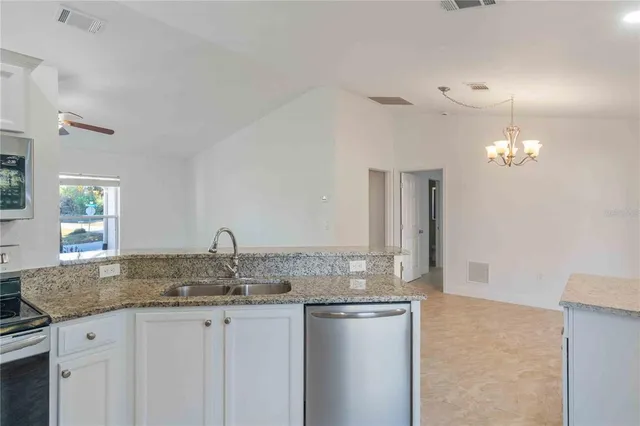 a kitchen with a sink and a window