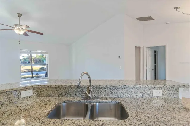 a view of a kitchen counter space and a sink