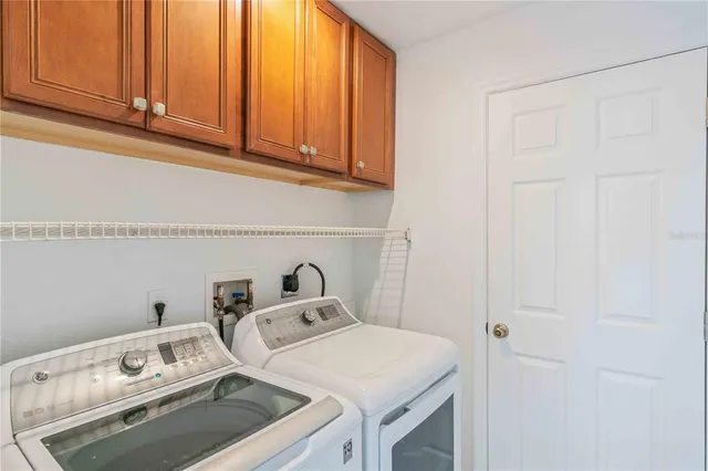 an empty room with wooden floor and outdoor space