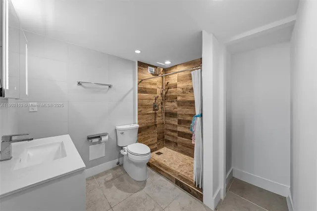 a bathroom with a toilet and a sink