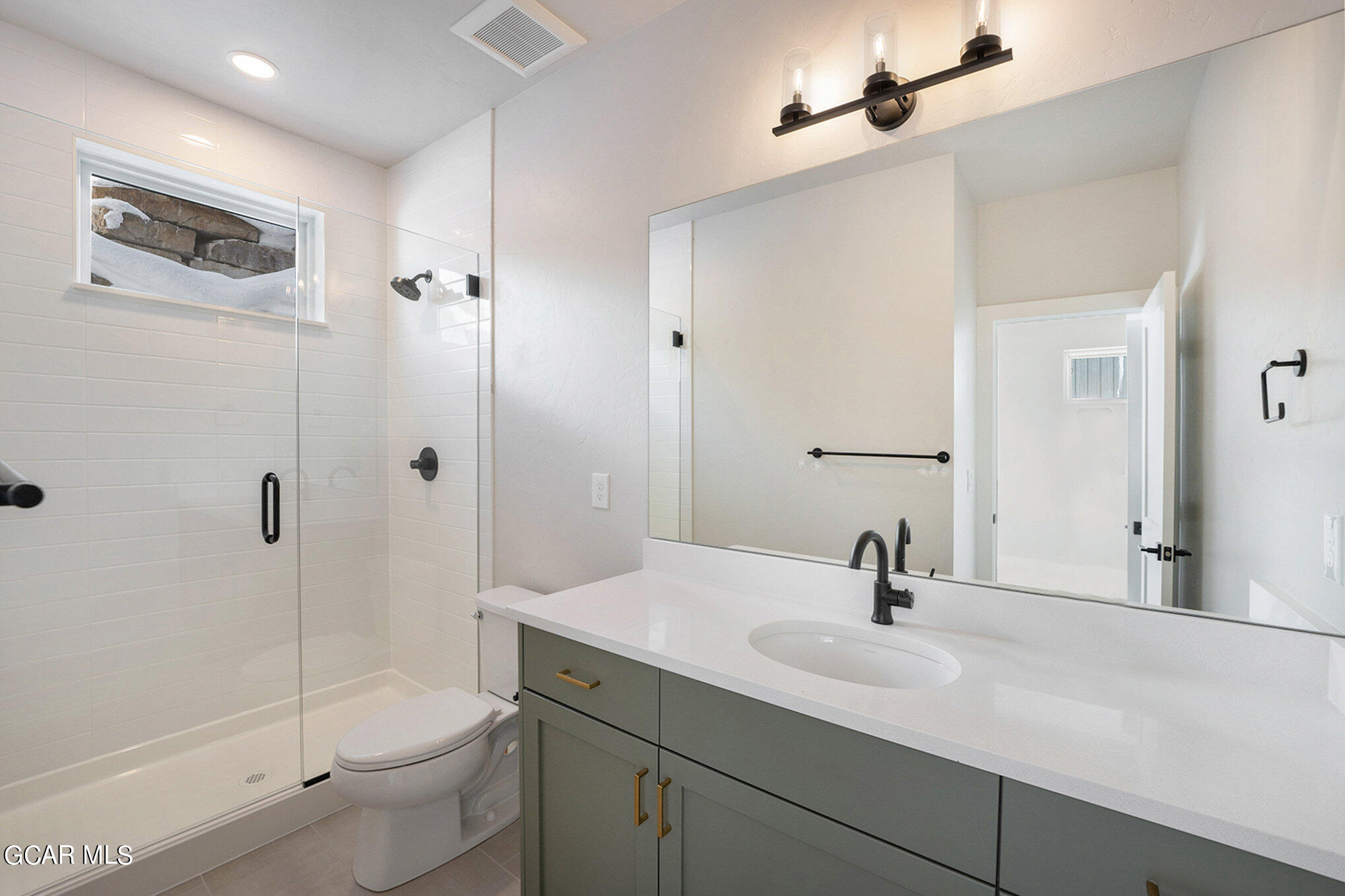 186 Homestead Loop Fraser, CO 80442 - Photo 19 of 29 a bathroom with a sink a toilet and shower