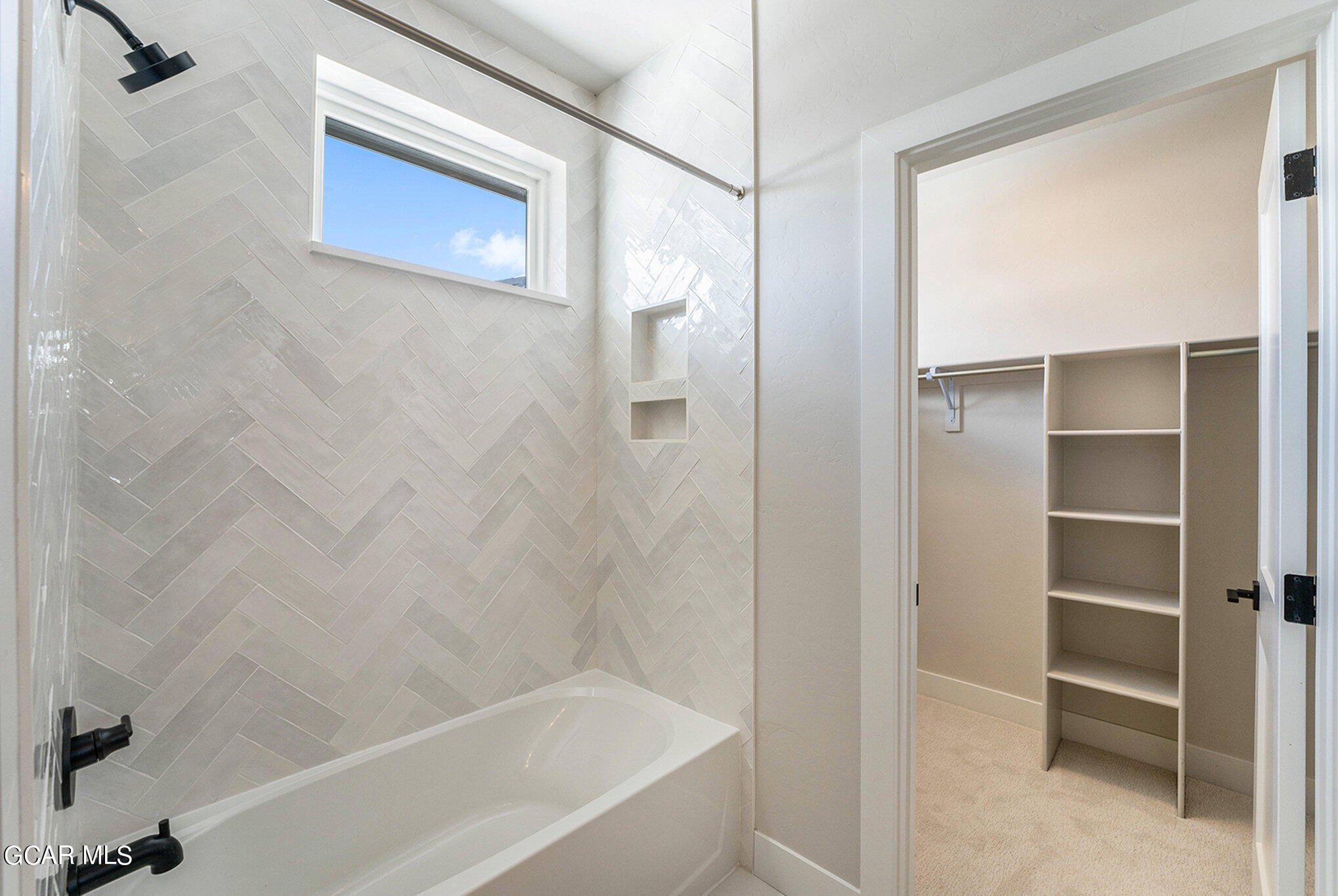 186 Homestead Loop Fraser, CO 80442 - Photo 24 of 29 a bathroom with a bathtub and a shower