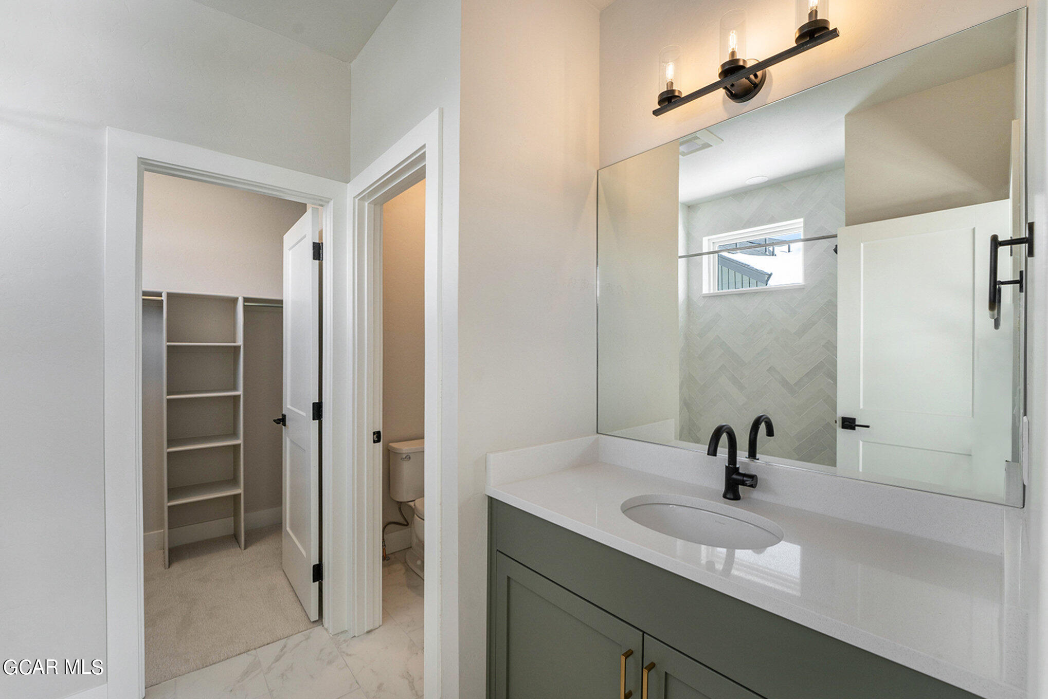 186 Homestead Loop Fraser, CO 80442 - Photo 25 of 29 a bathroom with a sink and a mirror