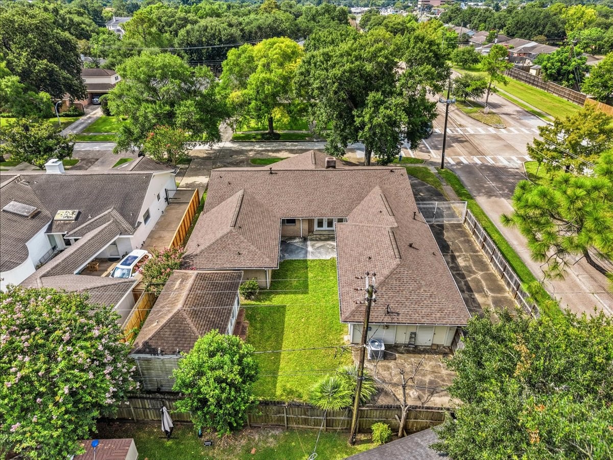 5762 Birdwood Road Houston, TX 77096 - Photo 47 of 50 NOTICE THE EXTENDED DRIVEWAY ON THE RIGHT SIDE OF THE PICTURE. THERE IS SPACE TO ADD A GARAGE OR PORTE-COCHERE IF DESIRED.