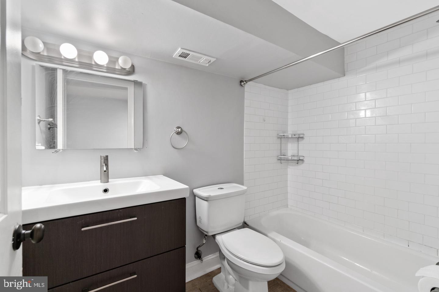 3416 Toone Street Baltimore, MD 21224 - Photo 12 of 18 a bathroom with a sink a toilet and shower