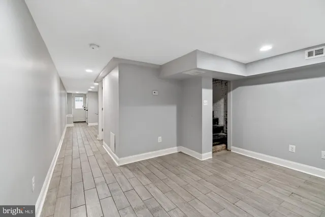a view of entryway with wooden floor