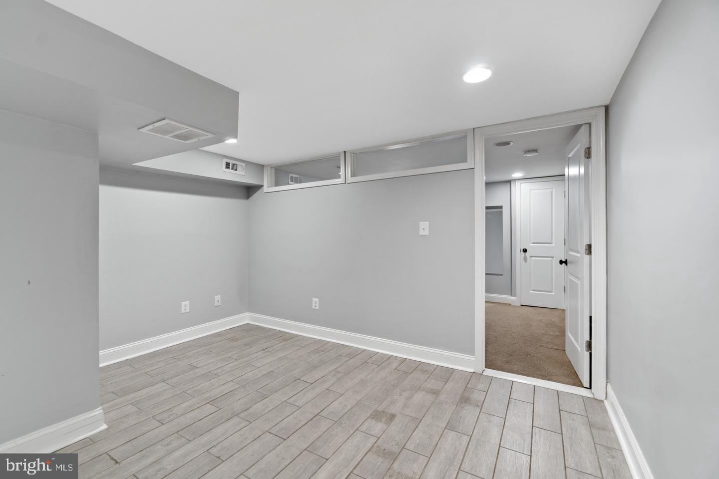 3416 Toone Street Baltimore, MD 21224 - Photo 6 of 18 a view of empty room with wooden floor