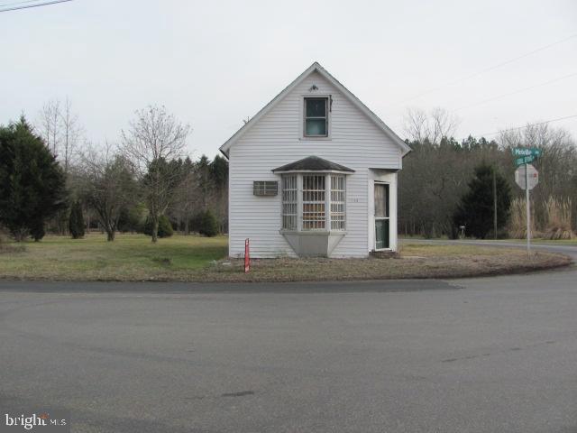 26355 Marydel Road Marydel, MD 21649 - Photo 2 of 4 a view of a house with a yard
