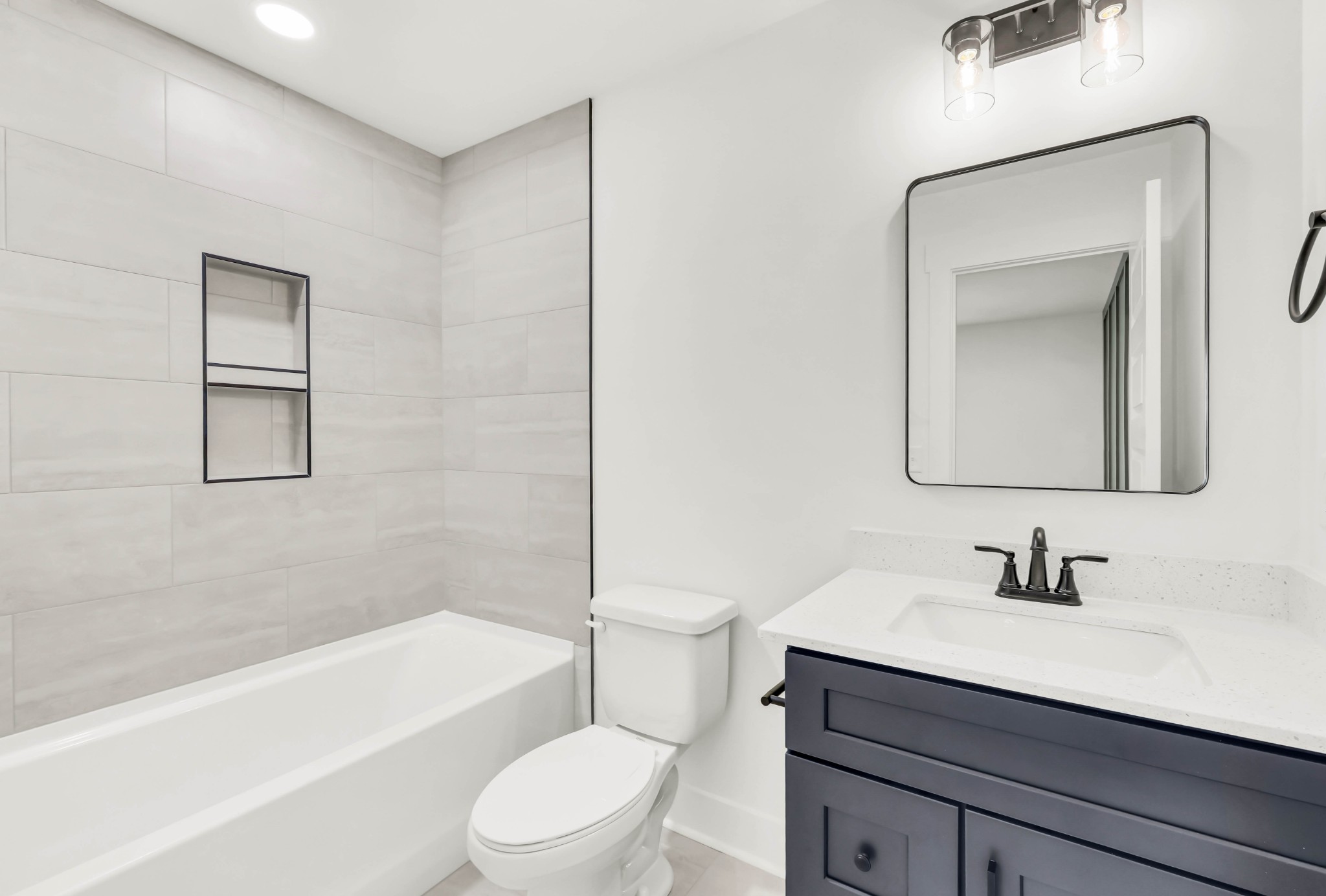 352 Front Rdg Circle Clarksville, TN 37042 - Photo 24 of 29 a bathroom with a sink a toilet a mirror and shower