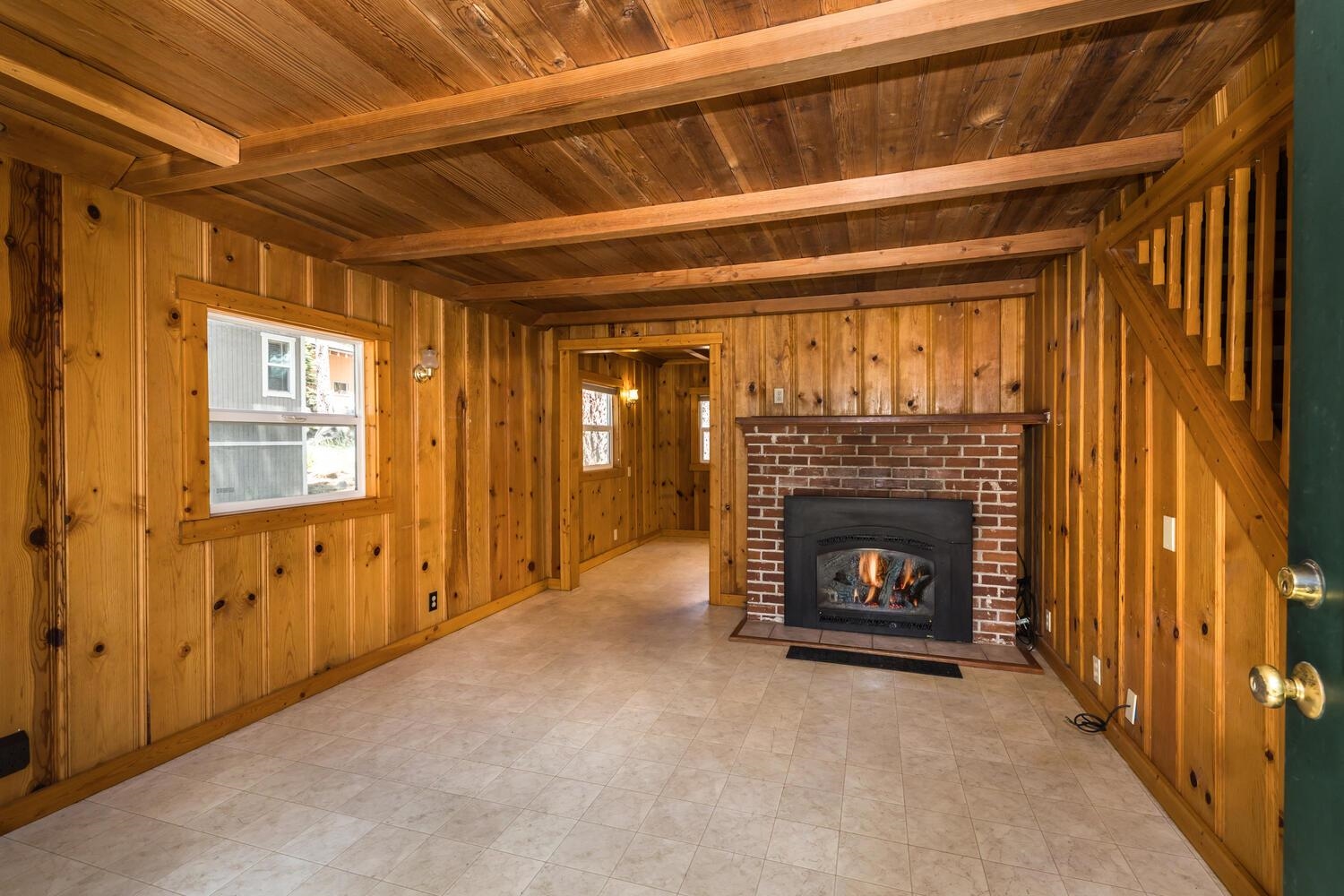 13464 Moraine Road Truckee, CA 96161 - Photo 13 of 25 a view of an empty room with fireplace and a window