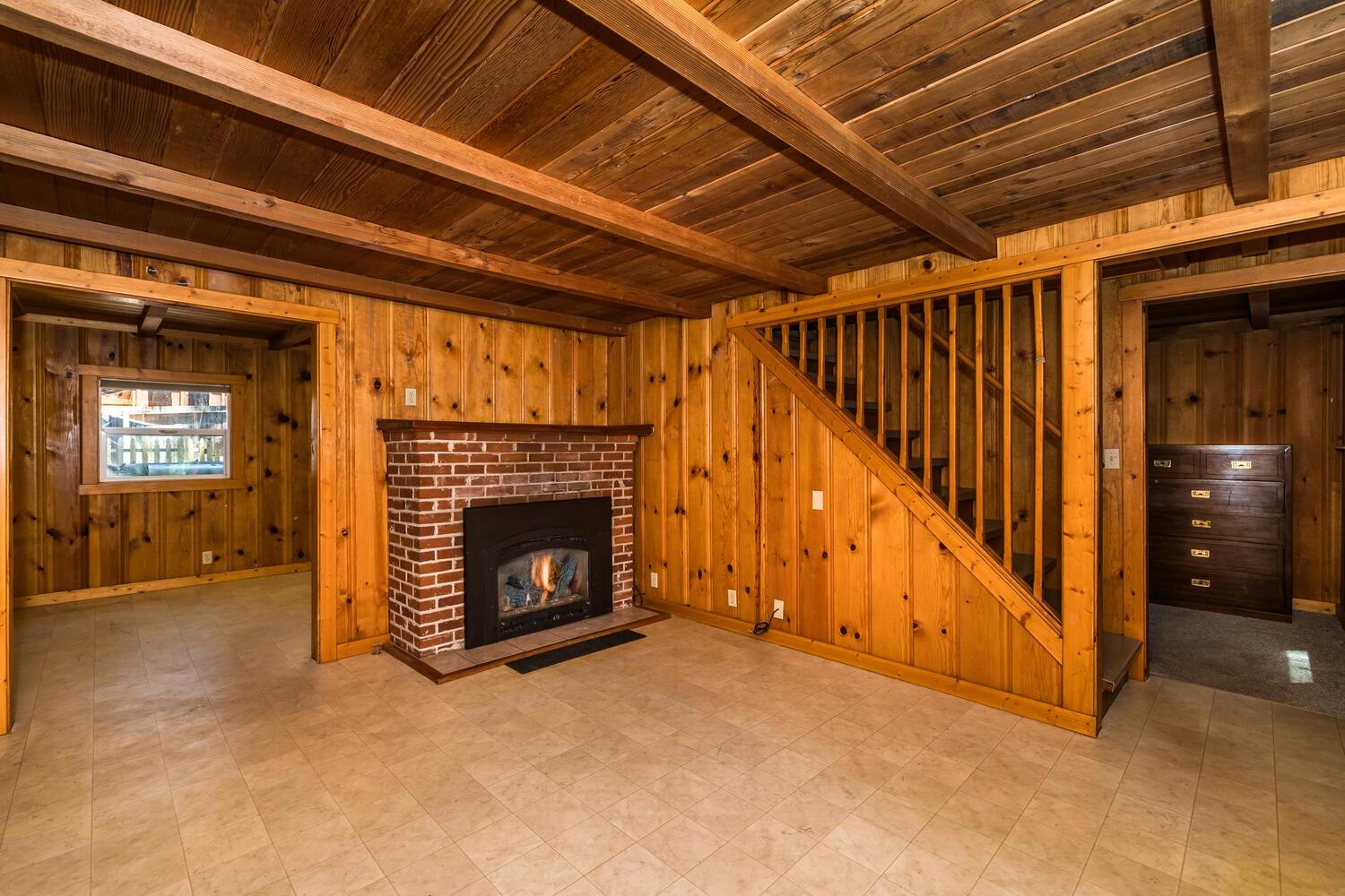13464 Moraine Road Truckee, CA 96161 - Photo 14 of 25 a view of an empty room with fireplace and a window