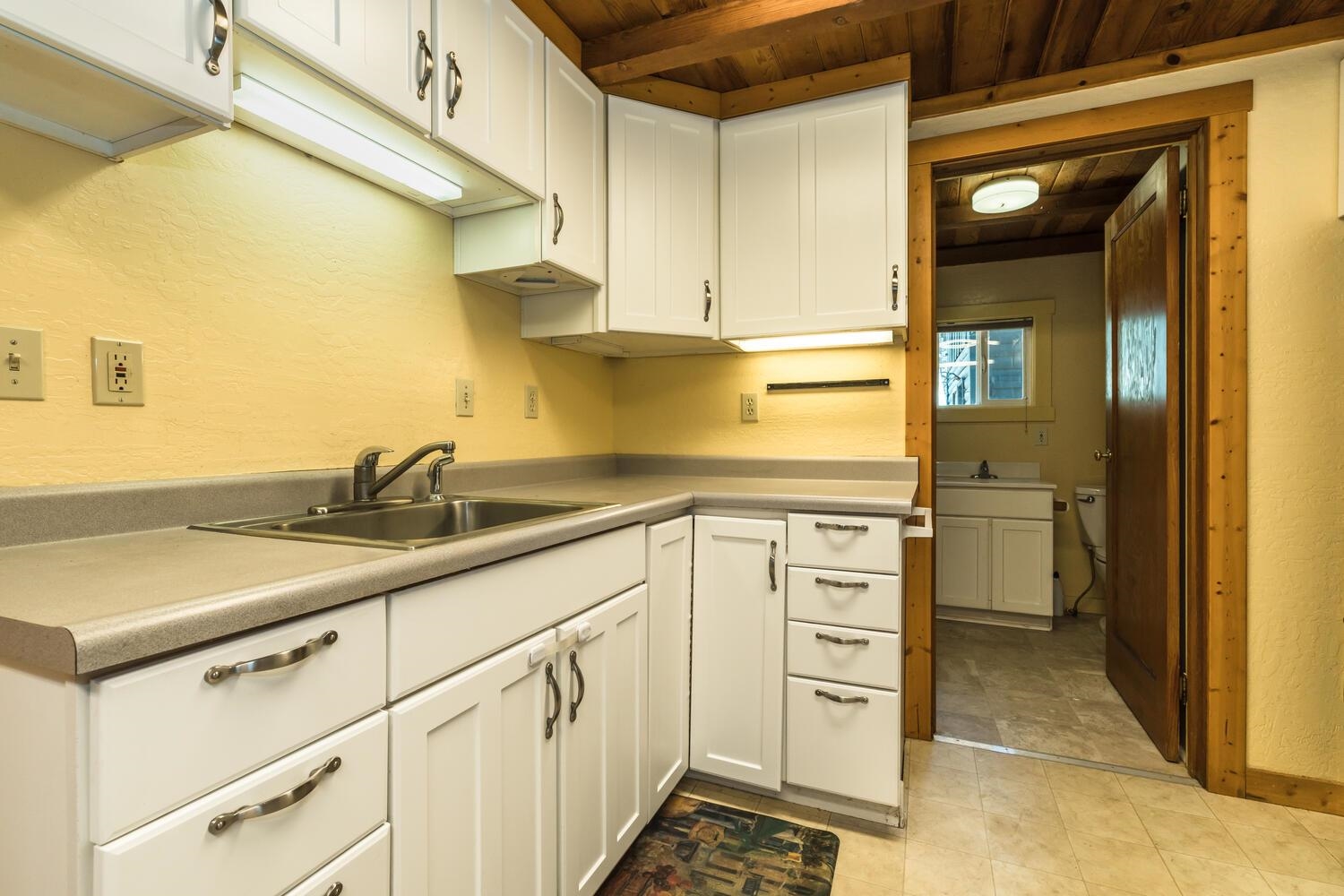 13464 Moraine Road Truckee, CA 96161 - Photo 18 of 25 a kitchen with stainless steel appliances granite countertop a sink and cabinets