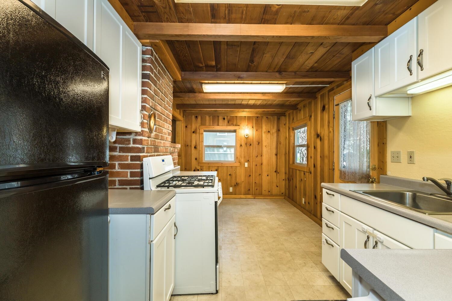 13464 Moraine Road Truckee, CA 96161 - Photo 19 of 25 a kitchen with a sink and refrigerator