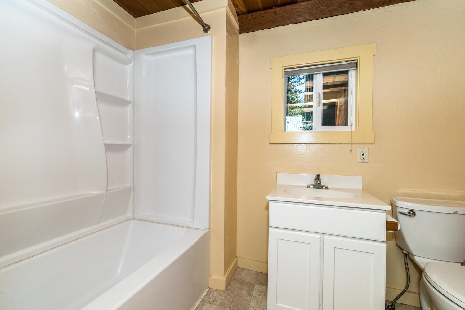 13464 Moraine Road Truckee, CA 96161 - Photo 20 of 25 a bathroom with a sink a bathtub and a window
