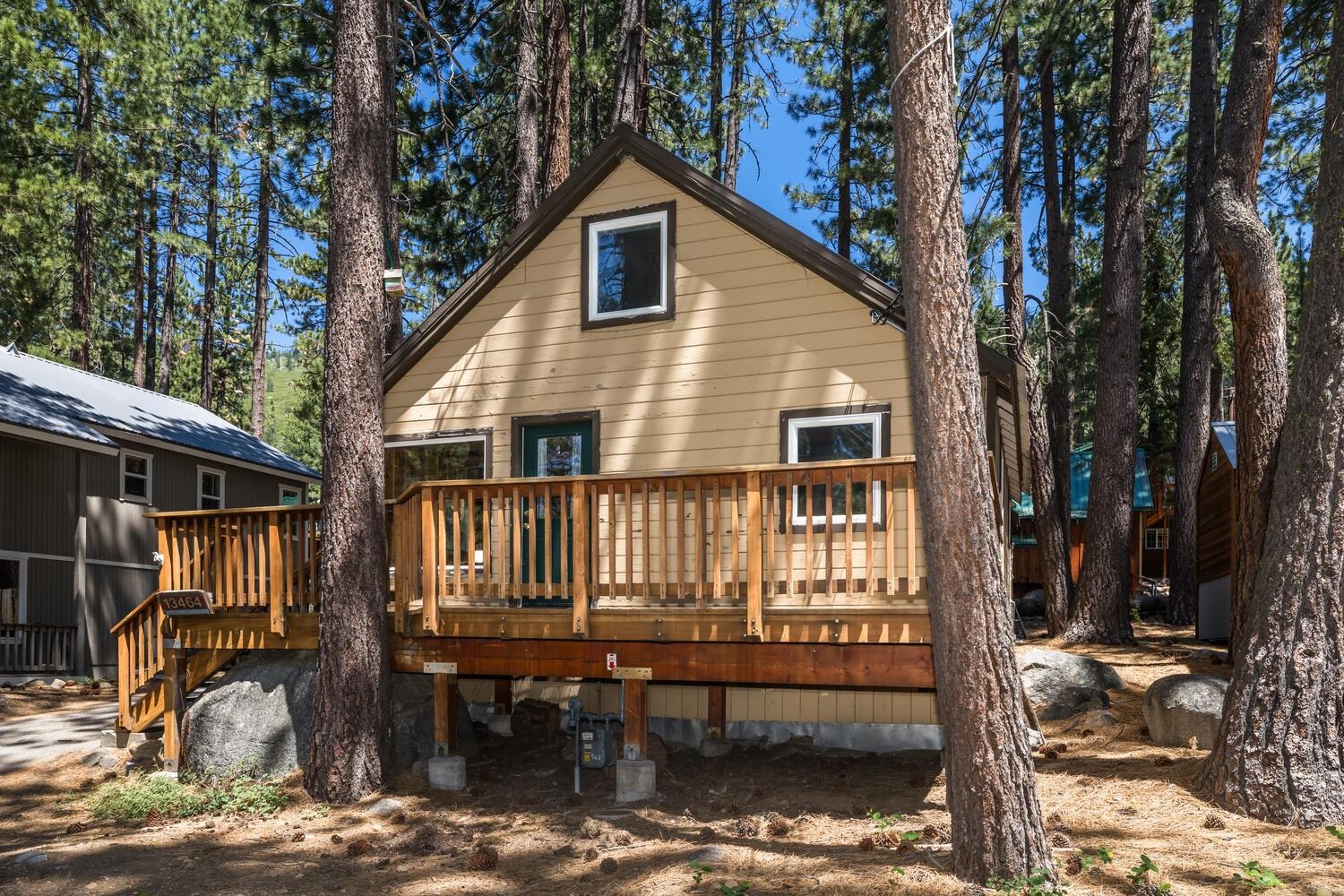 13464 Moraine Road Truckee, CA 96161 - Photo 2 of 25 a view of a house with a yard and wooden deck