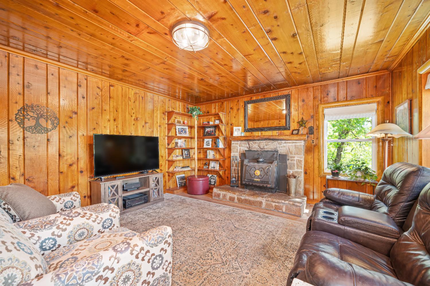 3240 Lone Star Mine Road Placerville, CA 95667 - Photo 11 of 59 a bedroom with furniture a flat screen tv and a fireplace