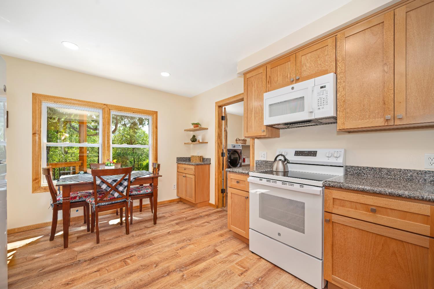 3240 Lone Star Mine Road Placerville, CA 95667 - Photo 2 of 59 a kitchen with appliances cabinets and wooden floor