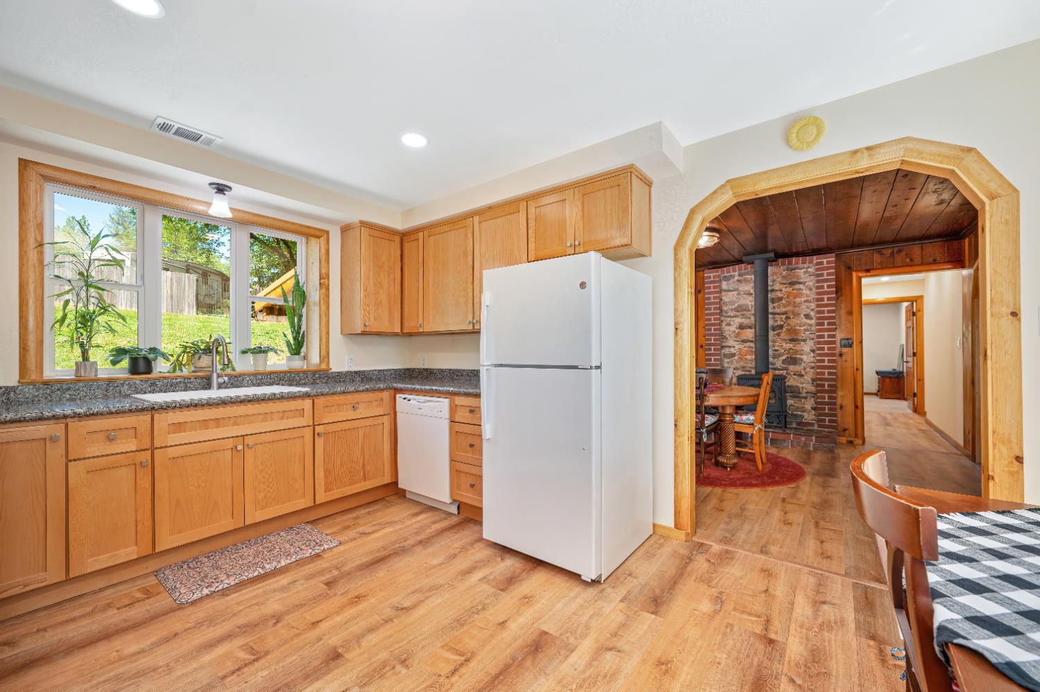 3240 Lone Star Mine Road Placerville, CA 95667 - Photo 21 of 59 a kitchen with a refrigerator a stove top oven and a large window