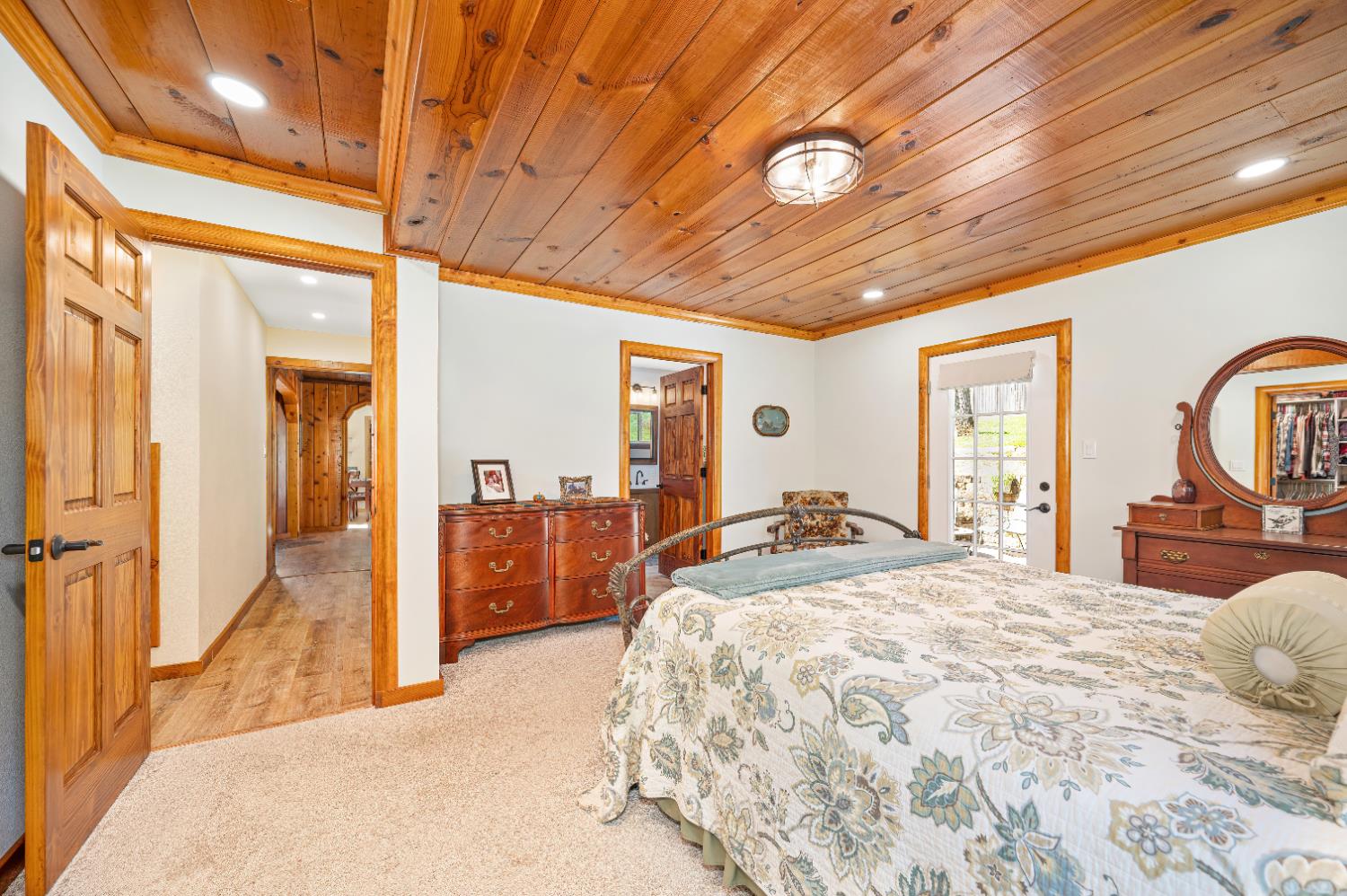 3240 Lone Star Mine Road Placerville, CA 95667 - Photo 29 of 59 a spacious bedroom with a large bed and a large window with the outer view