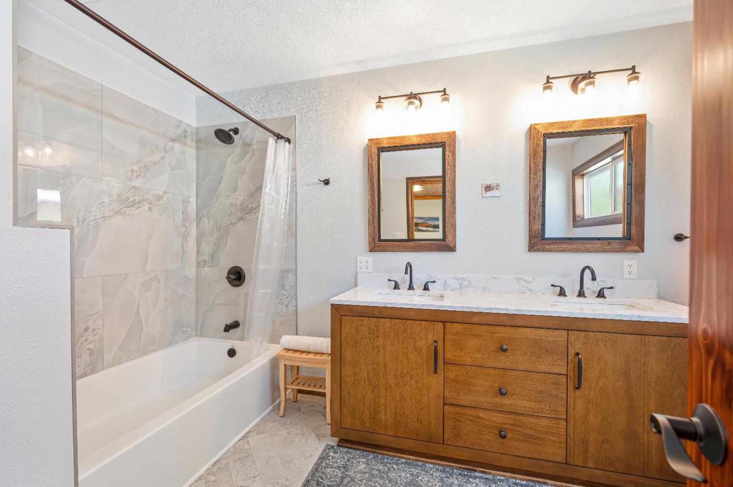 3240 Lone Star Mine Road Placerville, CA 95667 - Photo 33 of 59 a bathroom with a tub sink double vanity and mirror