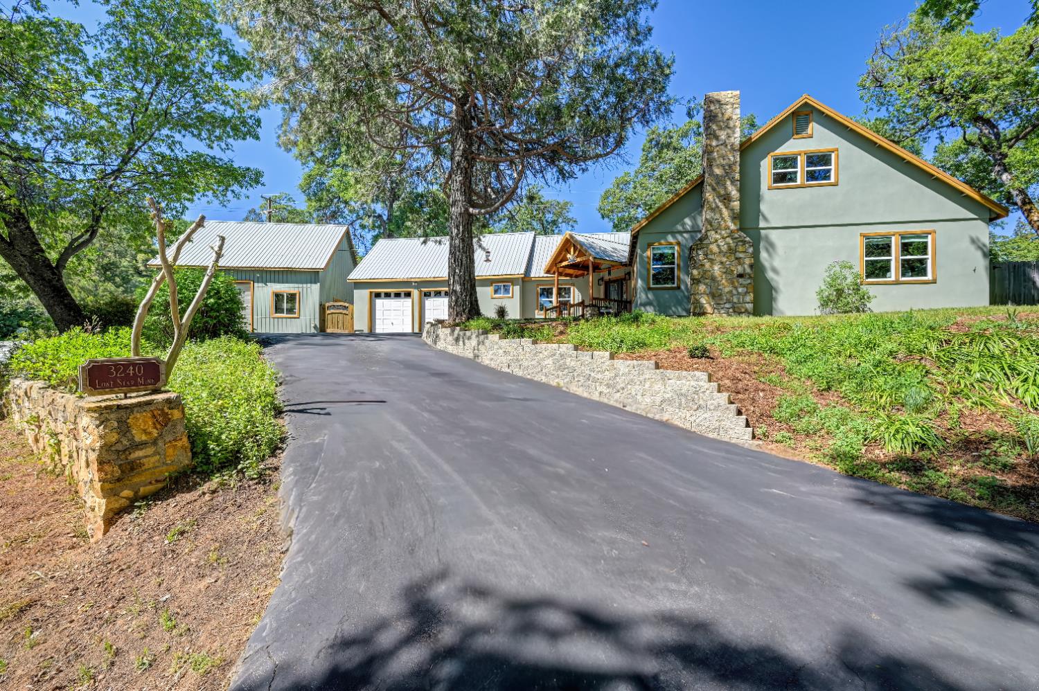 3240 Lone Star Mine Road Placerville, CA 95667 - Photo 4 of 59 a front view of a house with a yard and potted plants