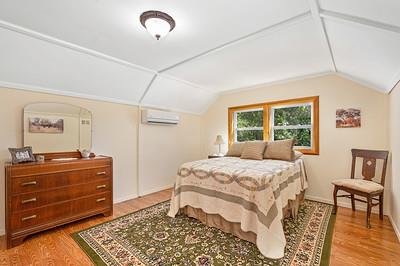 3240 Lone Star Mine Road Placerville, CA 95667 - Photo 42 of 59 a bedroom with a bed and wooden floor