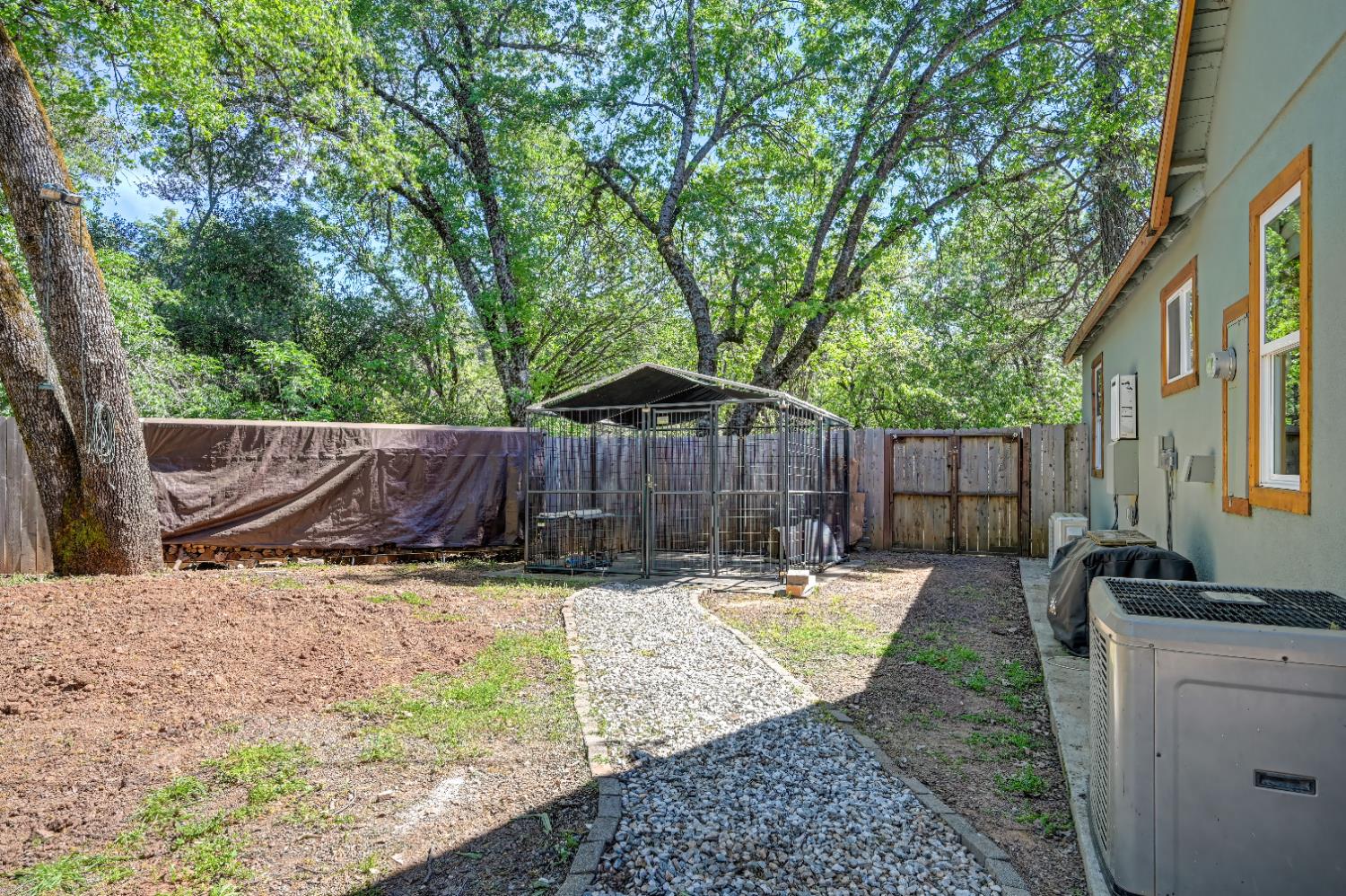 3240 Lone Star Mine Road Placerville, CA 95667 - Photo 53 of 59 a view of a backyard with a sink and couches chairs with wooden fence