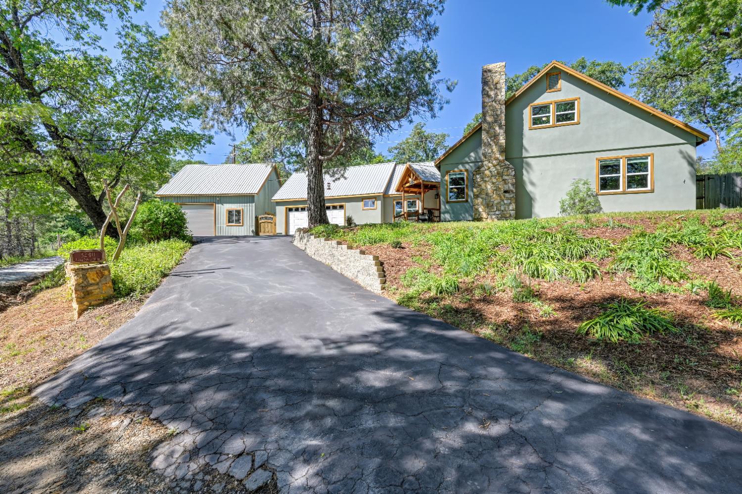 3240 Lone Star Mine Road Placerville, CA 95667 - Photo 7 of 59 a view of a white house with a yard and large tree