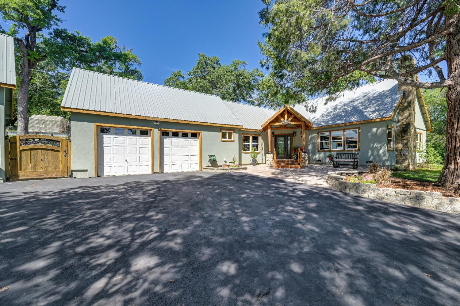 3240 Lone Star Mine Road Placerville, CA 95667 - Photo 8 of 59 a front view of a house with a yard and garage