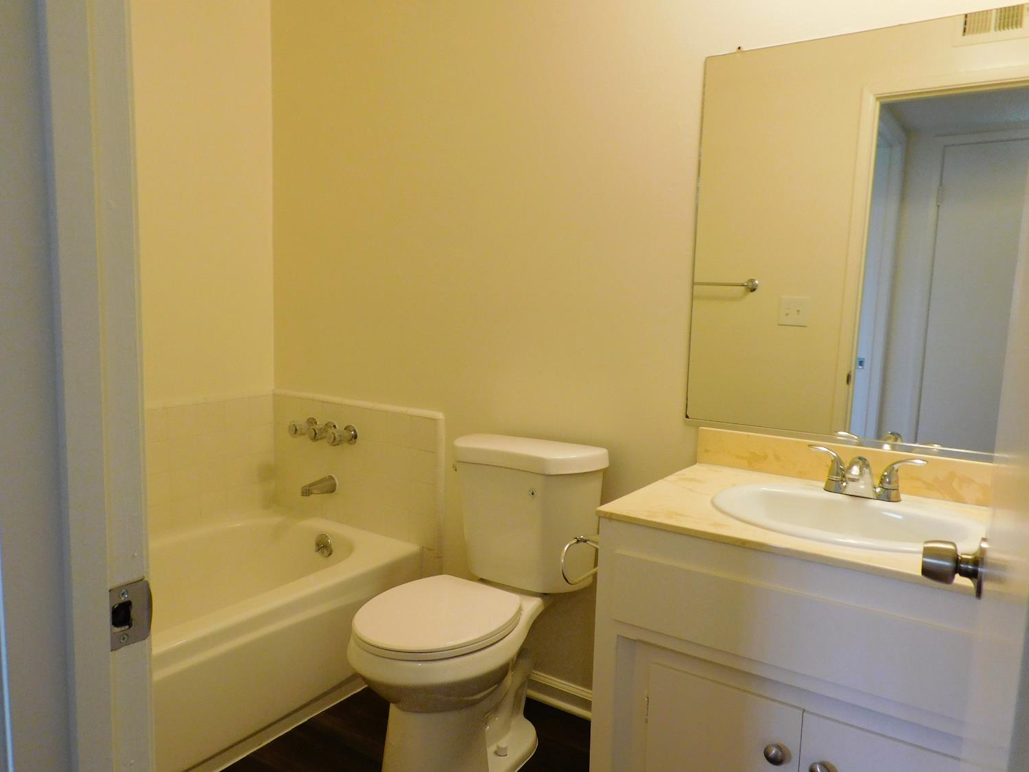 548 West Clinton Avenue Fresno, CA 93705 - Photo 4 of 7 a bathroom with a sink and a mirror