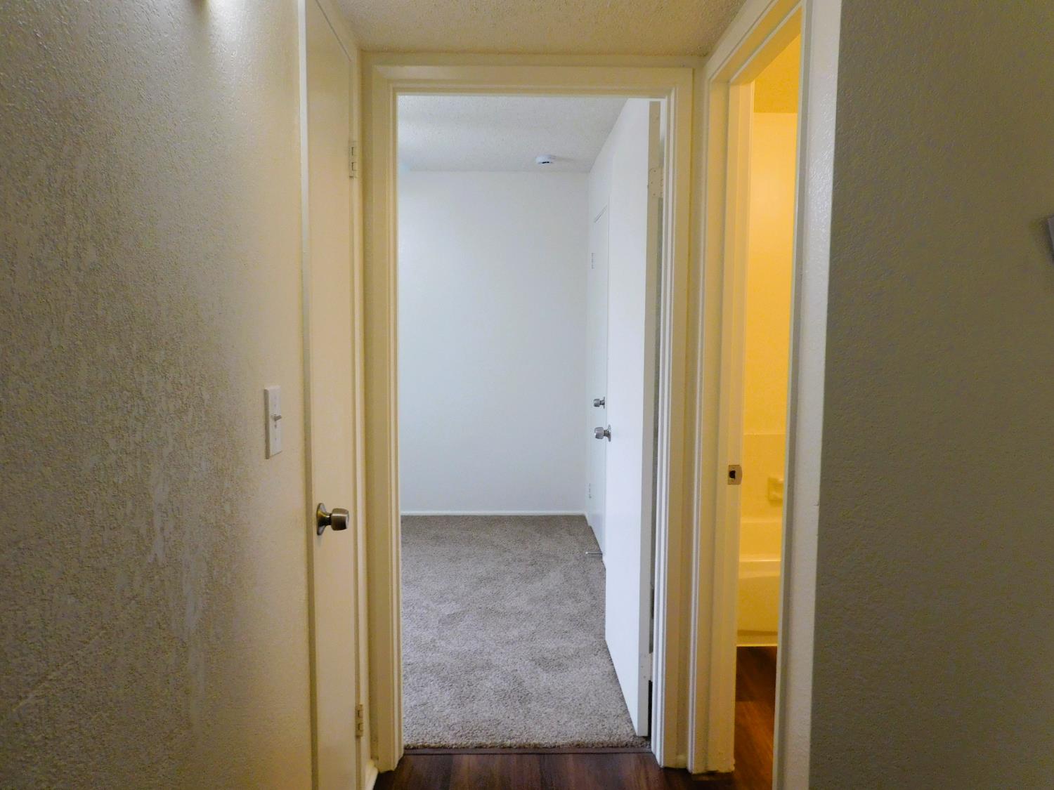 548 West Clinton Avenue Fresno, CA 93705 - Photo 5 of 7 a view of a bathroom with a glass door