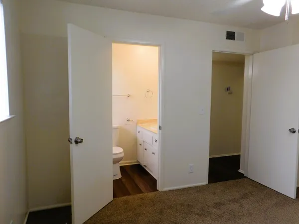 a view of a bathroom with white walls