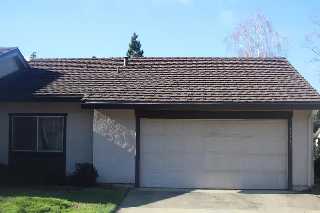 a black and white building with a outdoor space