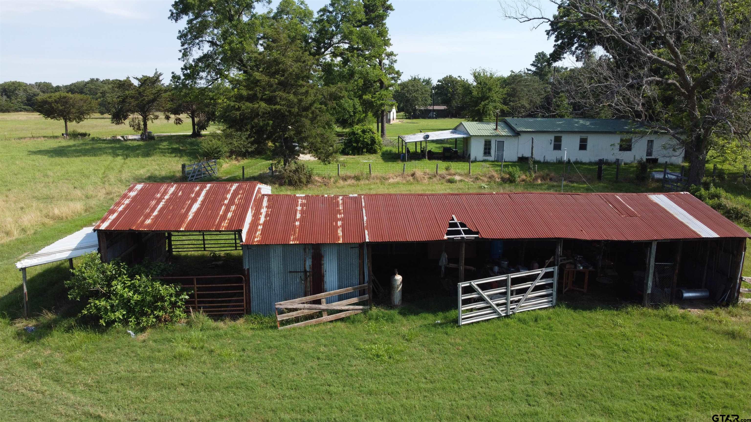 370 Rs Cr Emory, TX 75440 - Photo 4 of 9 a front view of a house with garden