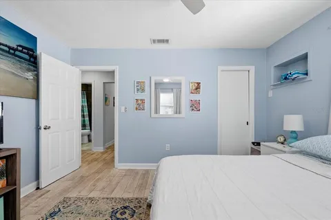 a bedroom with a bed and a couch