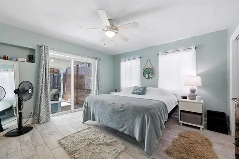 a bed room with a bed and a chandelier