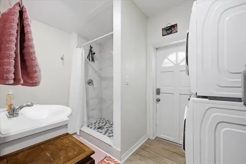 a bathroom with a sink toilet and shower