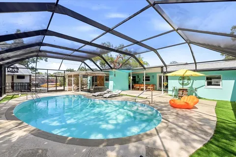 a view of a swimming pool with a patio