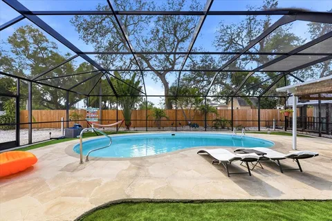 a view of a swimming pool with a patio