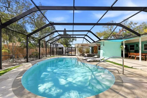 a view of a swimming pool with a patio