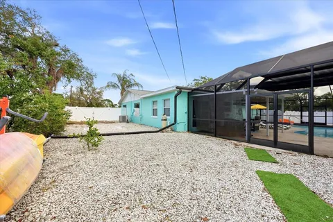an aerial view of a house with outdoor space and street view